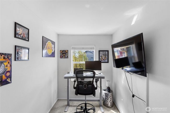 This flex space is larger than it appears! Could be used as an office, gym area or sitting area. | Image 16
