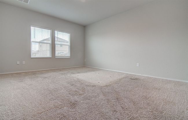 Empty room featuring carpet, visible vents, and baseboards | Image 16