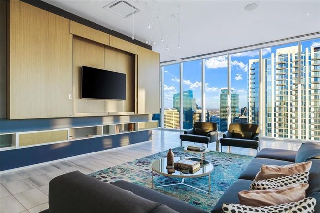 Amenity area for entertaining feat. Kitchen, dining, full gas range, TVs and expansive views. | Image 29