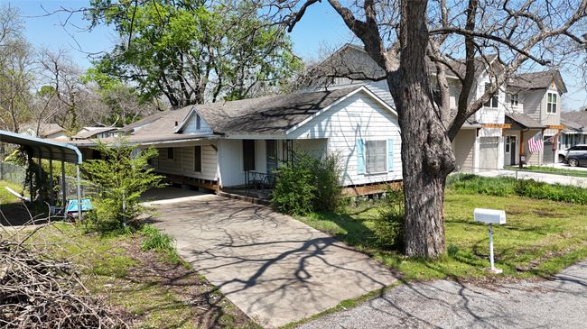 View of front of home featuring aphalt driveway, a carport, and a shingled roof | Image 5