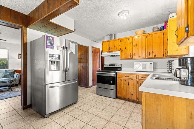 15950 Ne 50 Th St, Home with 4 bedrooms, 2 bathrooms and null parking in WILLISTON FL | Image 10