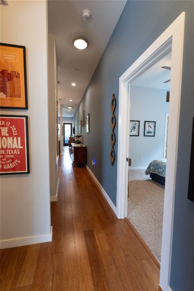 Hall featuring wood finished floors and baseboards | Image 12