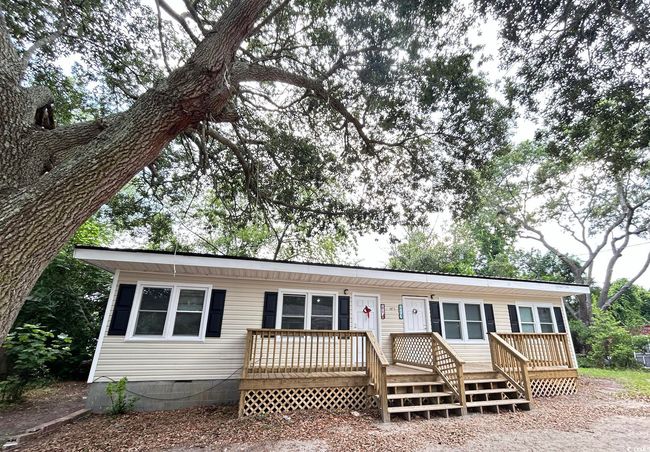 Manufactured / mobile home featuring a wooden deck and crawl space | Image 10
