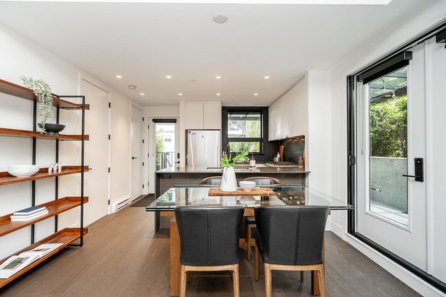 Dining space with dark wood-style floors, recessed lighting, and baseboard heating | Image 9