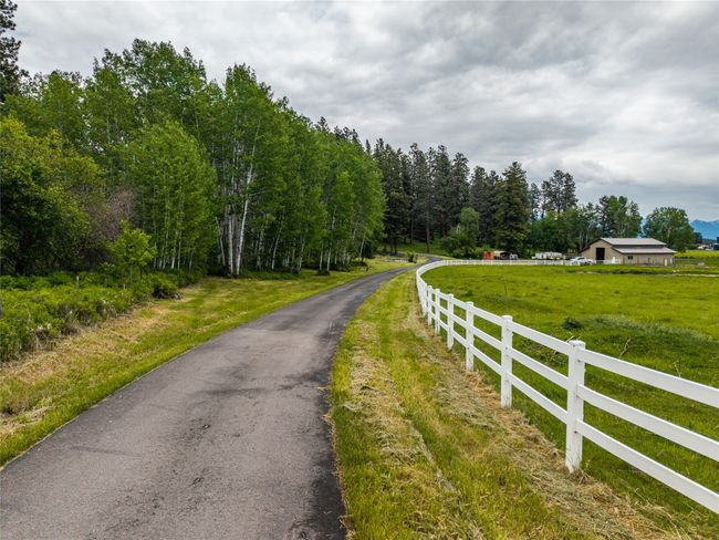 View of asphalt road with a rural view | Image 43