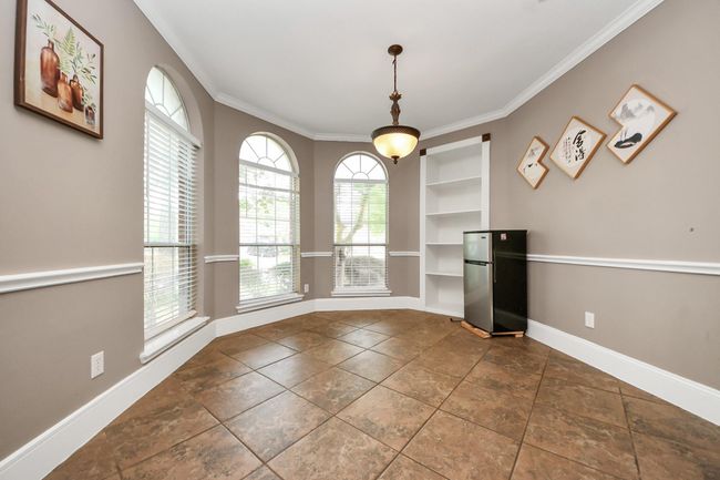 Formal dining with nice bay windows and built-ins. | Image 7