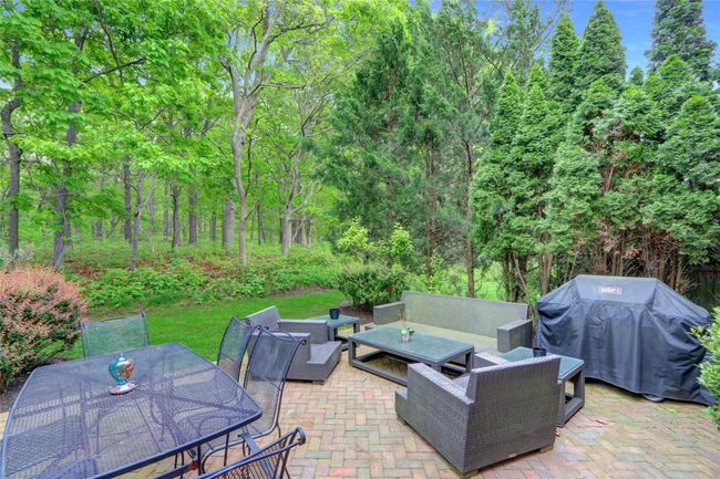 View of patio with an outdoor hangout area, grilling area, and outdoor dining area | Image 27