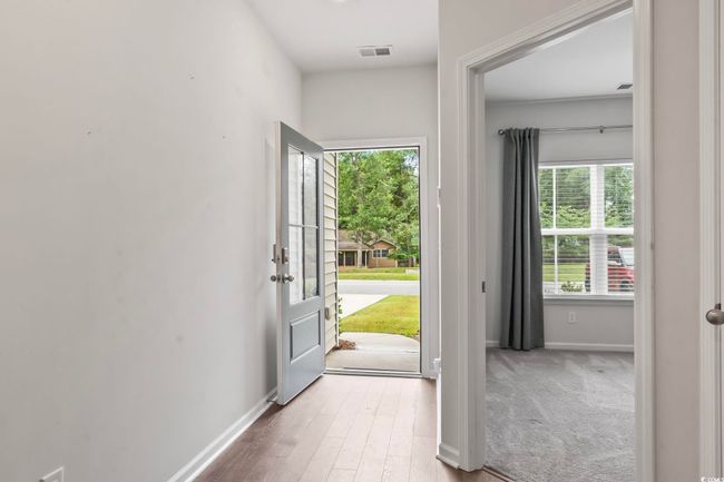 Foyer featuring healthy amount of natural light and wood finished floors | Image 29