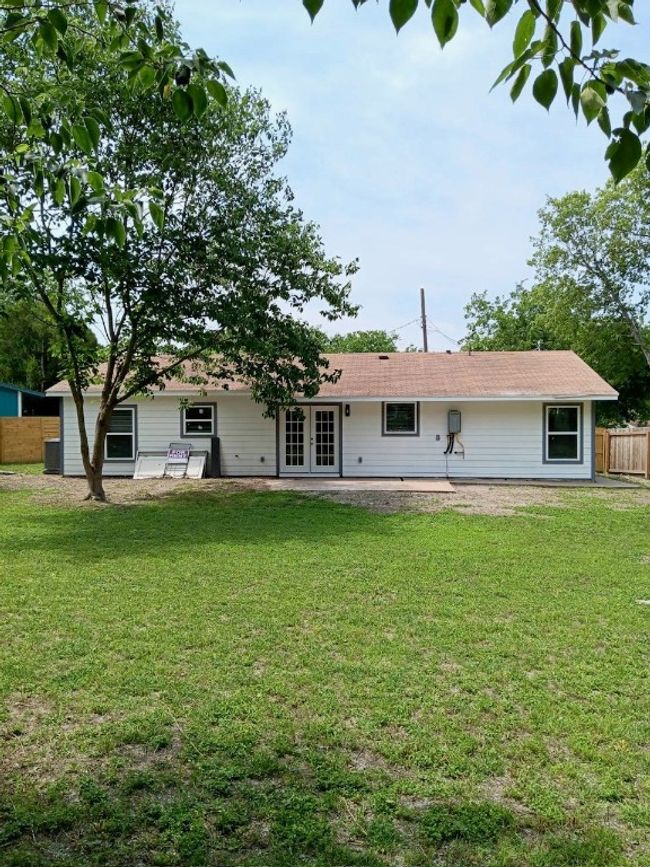 Rear view of house featuring french doors and a patio | Image 23