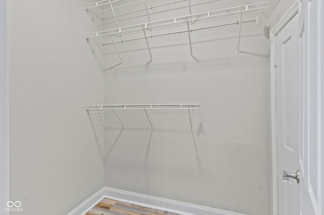 spacious closet featuring wood finished floors | Image 23