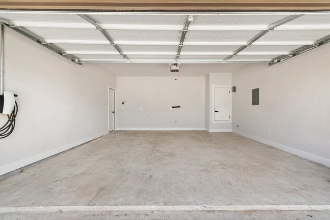 Garage with electric panel and a garage door opener | Image 23