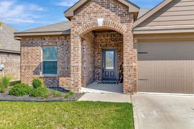 Entrance to property with a yard and a garage | Image 3