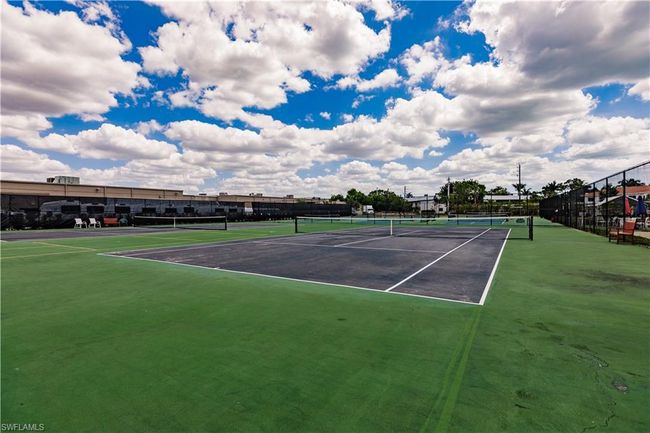 View of tennis court featuring fence | Image 39