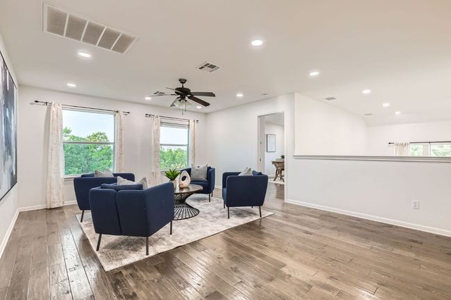 Living area with hardwood / wood-style flooring, baseboards, ceiling fan, and recessed lighting | Image 22