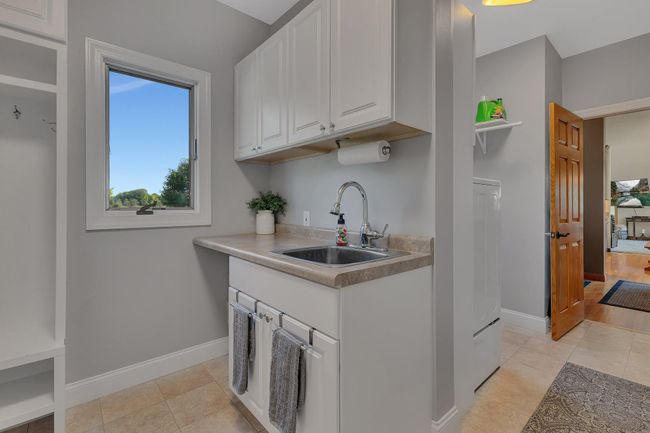 Utility sink in the laundry room | Image 35