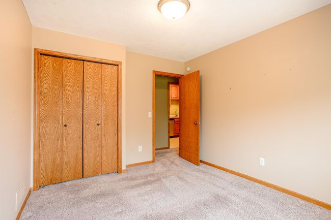 Includes a roomy double-door closet and easy hallway access, making this space flexible for a variety of needs. | Image 21