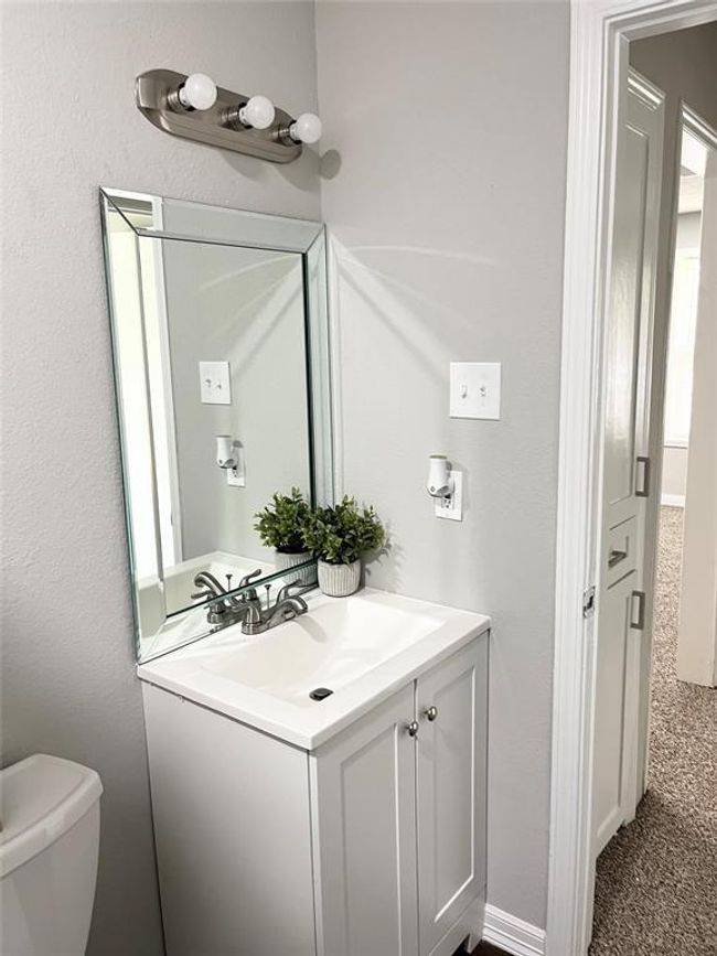 New vanity, lighting, toilet, and tub | Image 10
