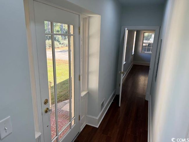 Doorway with dark hardwood / wood-style floors | Image 13