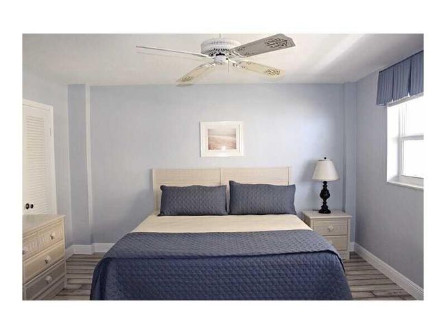 Bedroom #2 with walk in closet, bathroom access, and a king sized bed. Black out curtains to keep out the sun. | Image 25