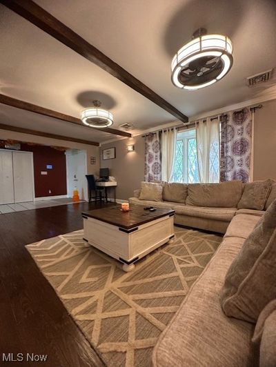 Living room with wood-type flooring and beamed ceiling | Image 3