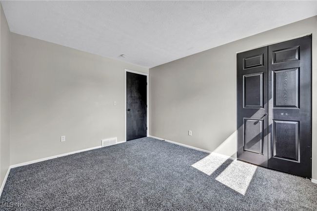 Empty room featuring carpet flooring and baseboards | Image 17