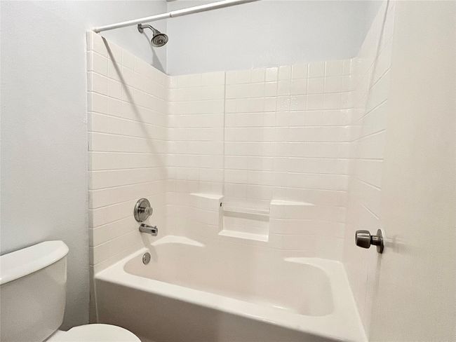 Full bath featuring toilet and tub / shower combination | Image 21