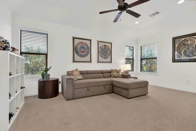 Carpeted living area featuring recessed lighting and ceiling fan | Image 16