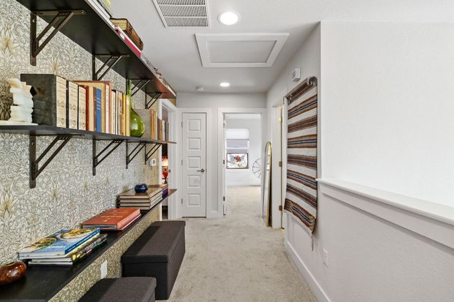 Corridor featuring visible vents, baseboards, recessed lighting, attic access, and light colored carpet | Image 18