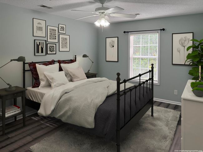 Bedroom featuring dark wood-style floors, baseboards, a textured ceiling, and a ceiling fan | Image 14
