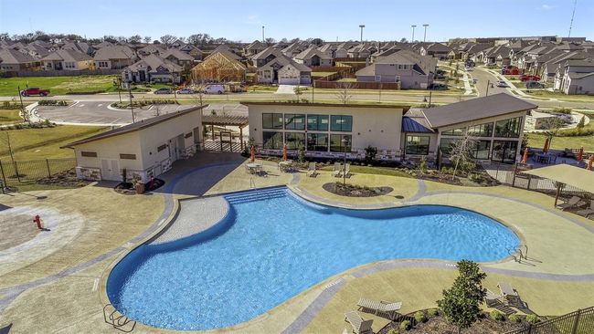View of pool with a residential view, fence, a fenced in pool, and a patio area | Image 31