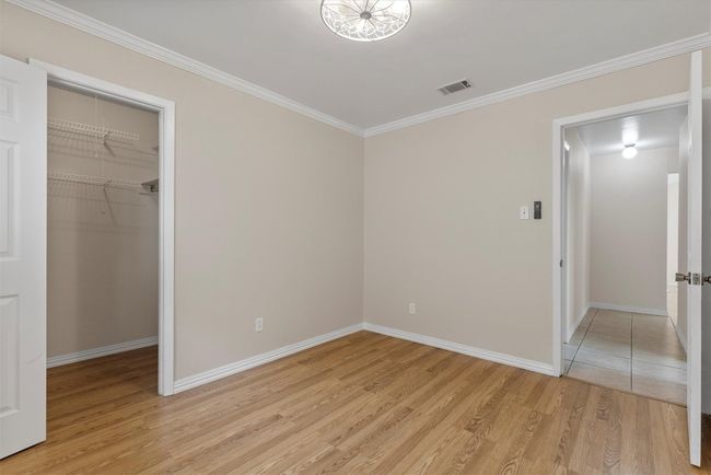 Generously sized closets in the guest bedrooms provide plenty of storage space, keeping everything organized and within reach | Image 16