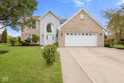 For starters, check out the fiber cement siding and exposed aggregate extensions on the driveway and sidewalk! | Image 3