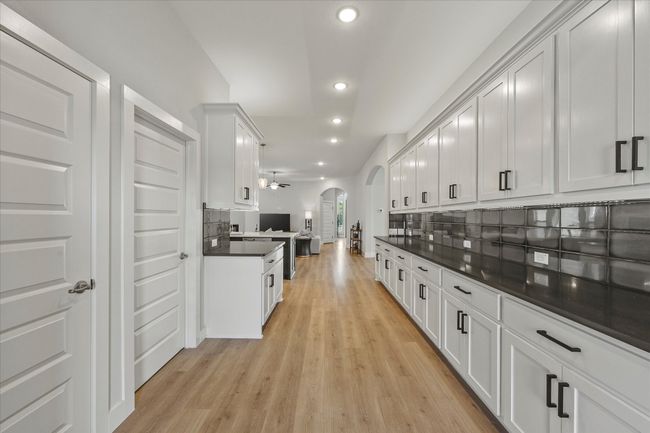 Kitchen includes build in stainless steel appliances including gas cooktop, oven, microwave & dishwasher | Image 19