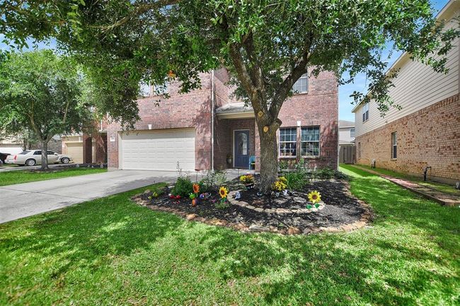 Charming brick home with a welcoming front yard and mature tree. Features a spacious driveway and inviting entrance. Perfect for your next chapter. | Image 47