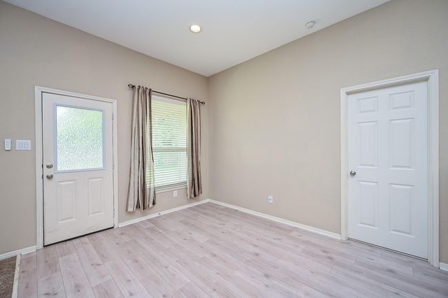 Bright breakfast area with light, easy to maintain vinyl plank flooring, and neutral walls. | Image 18
