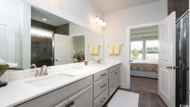 Full bathroom with a sink, a wealth of natural light, and ensuite bathroom | Image 23