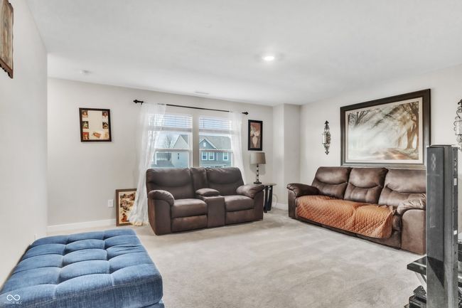 living room with carpet and baseboards | Image 24