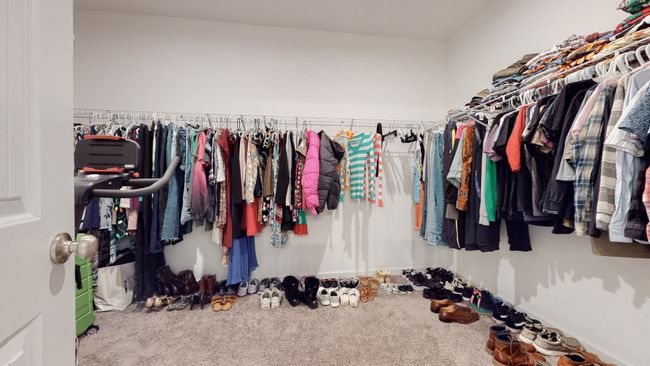 Gigantic primary closet off the bathroom. More shelving to left of picture. | Image 31