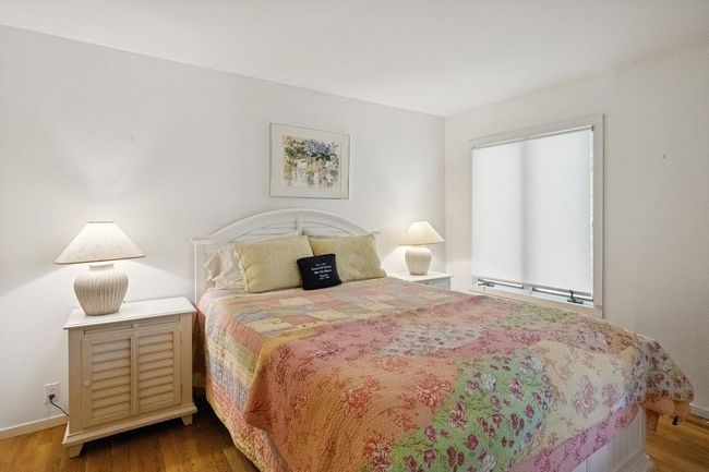 Bedroom featuring wood finished floors and baseboards | Image 10