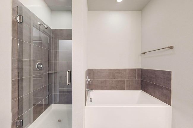 Bathroom featuring separate shower and tub | Image 12