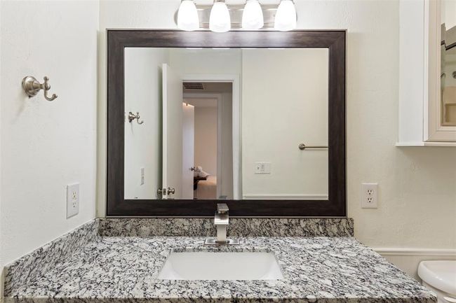 Bathroom featuring vanity and toilet | Image 17