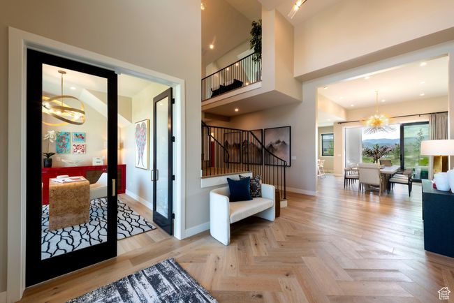 Foyer with a chandelier and stairway | Image 9