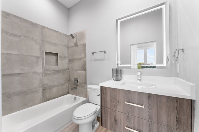 Bathroom featuring vanity, bathtub / shower combination, and toilet | Image 13
