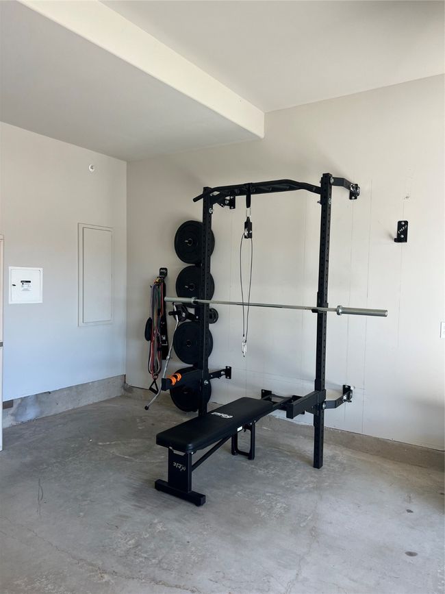 2 car garage with door opener and retractable workout weight station that can convey to the new buyer - View | Image 5