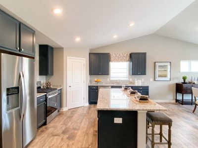 Stunning in every direction, the kitchen is also remarkably functional - leaving plenty of space for the family chef to maneuver and prepare that next meal. Photo of model, colors will vary | Image 3