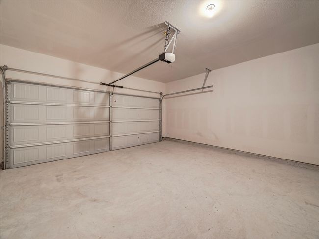 Garage with a garage door opener | Image 15