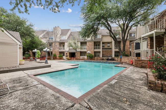 Outdoor pool featuring a patio area and a residential view | Image 28