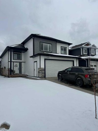 11306 59 Ave, House detached with 3 bedrooms, 2 bathrooms and 4 parking in Grande Prairie AB | Image 1