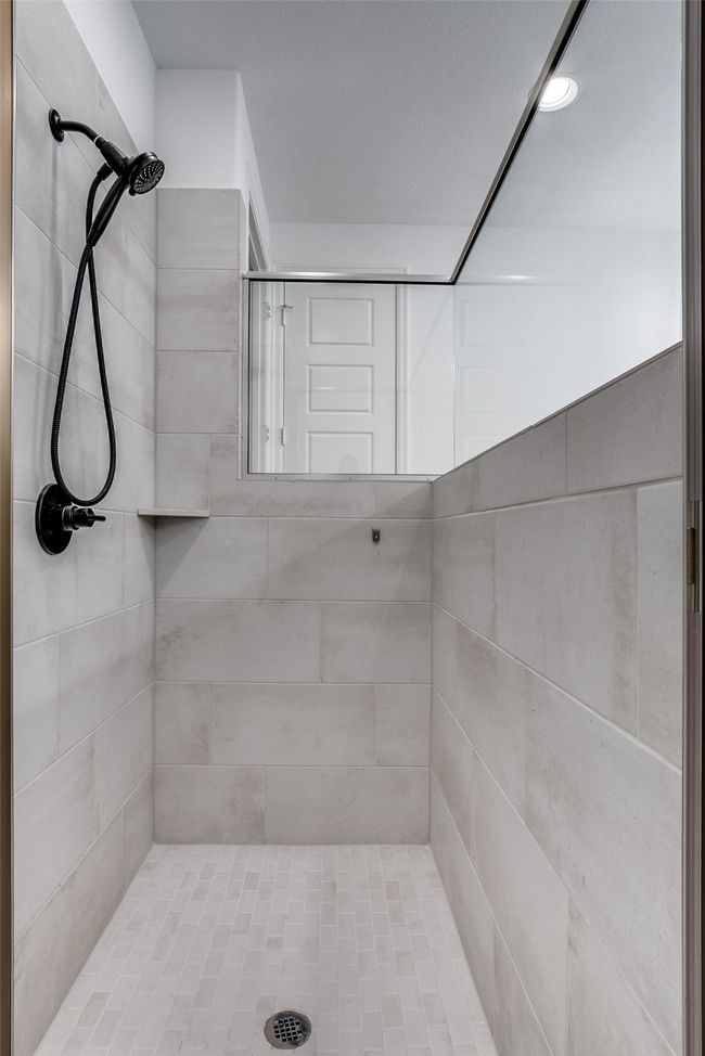 Bathroom featuring tiled shower | Image 23