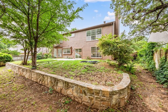 There's a small pond and terraced landscaping for added interest. | Image 37